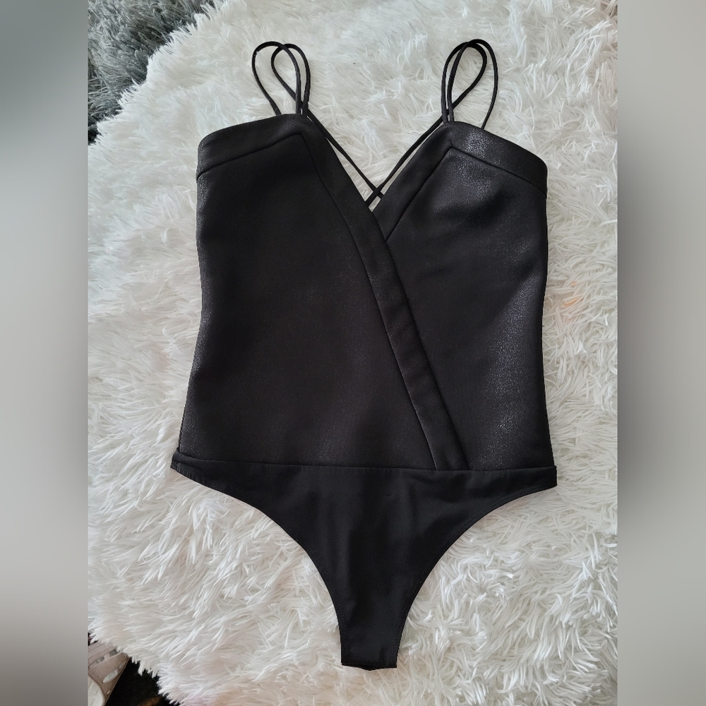 Dynamite Bodysuit in size medium with snap closure
